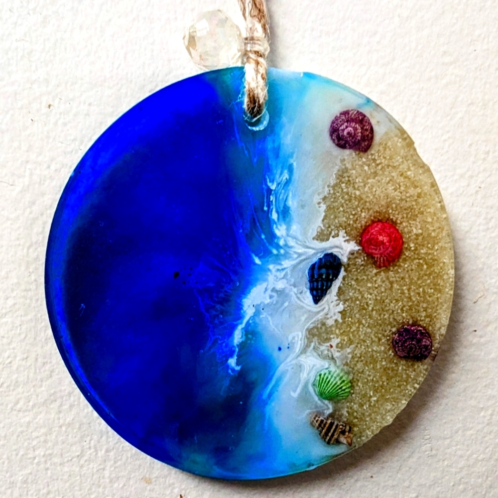 Handmade beach ornament with real shells and sand